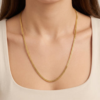 Superior Silver 26-inch flat Franco chain necklace in 14kt yellow gold over 925 sterling silver worn on a model.
