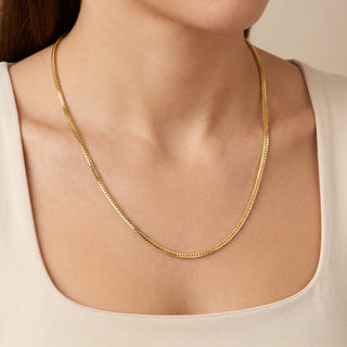 Superior Silver 22-inch flat Franco chain necklace in 14kt yellow gold over 925 sterling silver worn on a model.