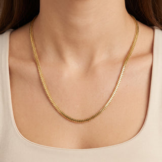 Superior Silver 18-inch flat Franco chain necklace in 14kt yellow gold over 925 sterling silver worn on a model