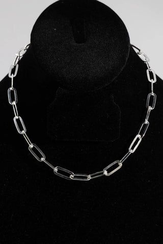 Superior Silver 6.7mm flat paper clip chain necklace crafted in polished 925 sterling silver on a black display bust.