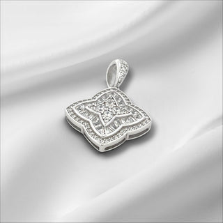 Superior Silver sterling silver flower charm pendant with sparkling cubic zirconia stones on a white background.