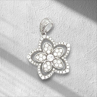 Superior Silver sterling silver flower charm pendant with sparkling cubic zirconia stones on a white background.