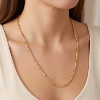 Superior Silver 22-inch Franco link chain in 14kt yellow gold over 925 sterling silver worn around a woman's neck.