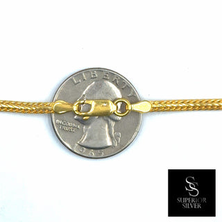 Superior Silver 14kt yellow gold over 925 sterling silver flat Franco chain with a lobster clasp on a US quarter.