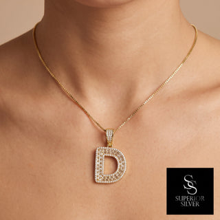Superior Silver gold initial D pendant featuring pave-set cubic zirconia stones worn on a delicate gold chain