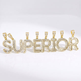 Superior Silver gold initial pendants spelling SUPERIOR, featuring pave-set CZ stones on 14kt gold over sterling silver.