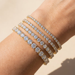 Superior Silver gold vermeil moissanite tennis bracelets in various stone sizes stacked on a wrist