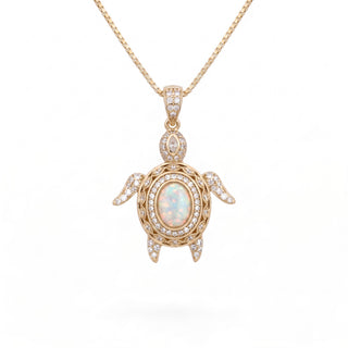 Superior Silver gold-plated sterling silver turtle pendant featuring an oval opal stone and sparkling cubic zirconia.