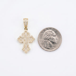 Superior Silver iced gothic cross pendant in gold vermeil with 0.8ct VVS D moissanite stones next to a US quarter.