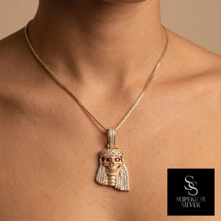 Superior Silver Jesus pendant in 14K yellow gold with natural diamonds and ruby eyes worn on a gold chain