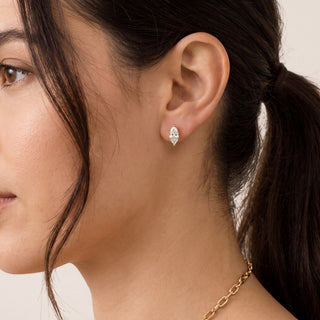 Superior Silver marquise cut moissanite stud earrings worn on a model, featuring a brilliant solitaire stone.