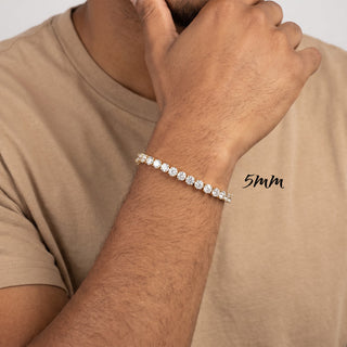 Superior Silver round brilliant moissanite tennis bracelet in gold vermeil worn on a man's wrist