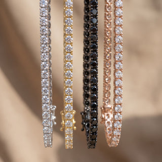 Superior Silver moissanite tennis bracelets in silver, gold, black rhodium, and rose gold finishes with four-prong set