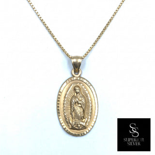 Superior Silver 10K yellow gold oval Mother Mary medallion pendant with diamond-cut detailing on a gold chain