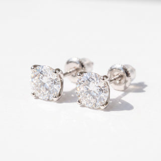Superior Silver Portuguese cut moissanite stud earrings in white gold vermeil with secure screw backs.