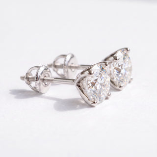 Superior Silver Portuguese cut moissanite stud earrings in white gold vermeil with secure screw backs.