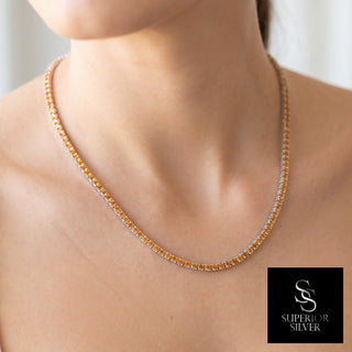 Superior Silver 18 inch tennis chain with round cut natural citrine in a rhodium plated sterling silver setting.