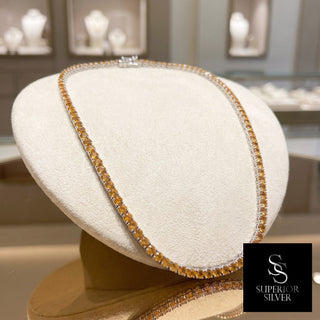 Superior Silver 18 inch round cut citrine tennis chain in sterling silver, close view of the four-prong setting.