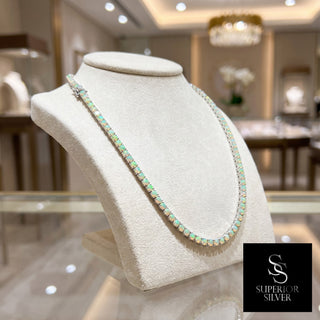 Superior Silver round cut Ethiopian opal tennis chain in sterling silver displayed on a jewelry bust.