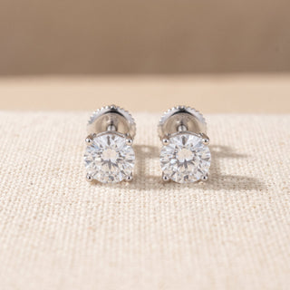 Superior Silver 6mm round moissanite solitaire stud earrings in rhodium-plated 925 sterling silver with screw backs.