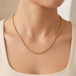 Superior Silver 18-inch rounded Franco link chain in 14kt yellow gold over 925 sterling silver worn on a model