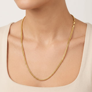 Superior Silver 24-inch rounded Franco chain necklace in 14kt yellow gold over solid 925 sterling silver on a model