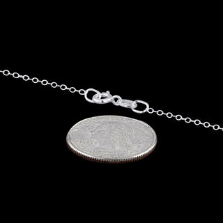 Superior Silver 1.4mm cable chain necklace in 925 sterling silver with a spring clasp, shown next to a US quarter.
