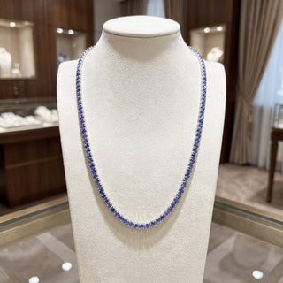 Superior Silver round cut tanzanite tennis chain in 925 sterling silver displayed on a jewelry mannequin