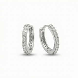Pair of silver hoop earrings with clear stones on a white background