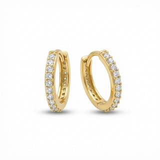 Gold hoop earrings with diamond accents on a white background