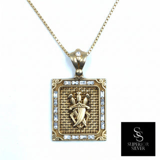 Superior Silver triple sword pendant in 10K yellow gold featuring sparkling CZ stones and diamond-cut detailing.