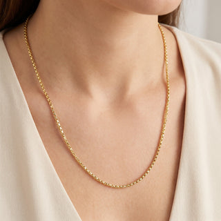 Superior Silver 26-inch twisted box link chain in 14kt yellow gold over 925 sterling silver worn on a model