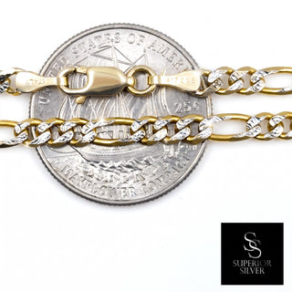 Superior Silver 10K two-tone yellow gold Figaro link chain with diamond-cut facets and a lobster clasp on a coin