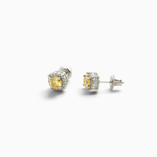 Superior Silver round 7mm yellow moissanite halo stud earrings in rhodium-plated sterling silver with screw backs.