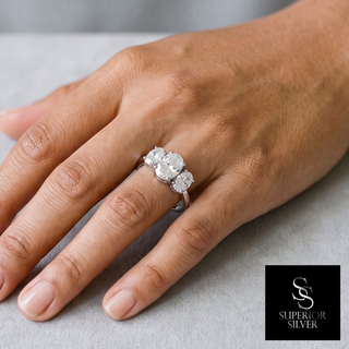 Three-Stone Oval Moissanite Ring in sterling silver, worn on hand
