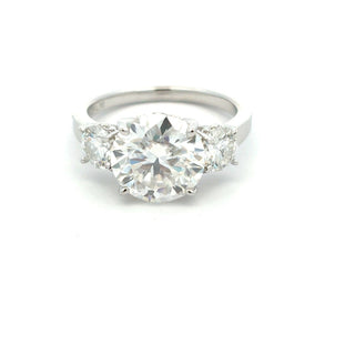 Three-Stone round with trillion sides moissanite ring in sterling silver