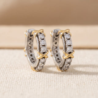 Two tone 10mm slim moissanite X motif huggie hoop earrings, macro detail of the hinge