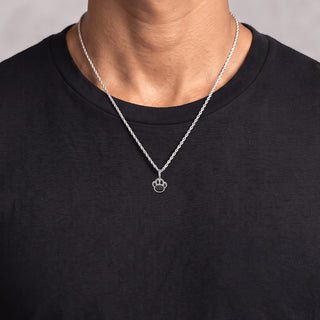 Two-Tone Pavé Paw Print Moissanite Pendant in sterling silver, worn on model