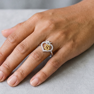 Two-Tone Quinceanera 15 Crown Heart Moissanite Ring in two-tone sterling silver, worn on hand